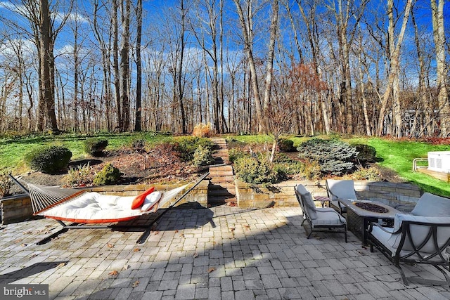 view of patio with an outdoor fire pit