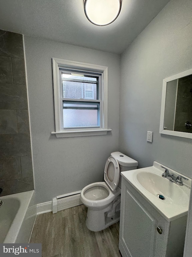 full bathroom with baseboard heating, vanity, toilet, shower / bathing tub combination, and hardwood / wood-style flooring