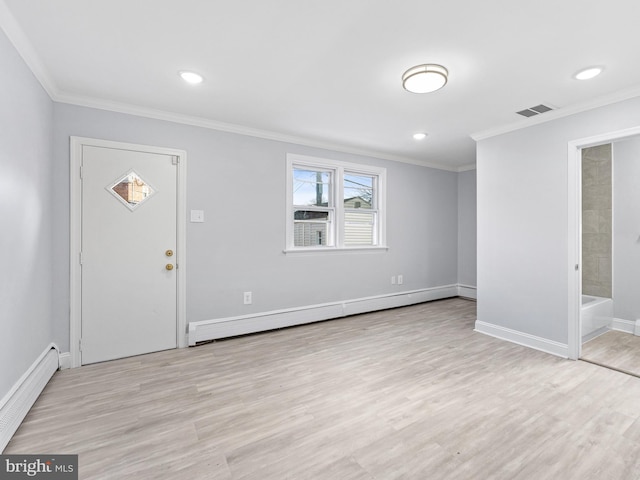 entryway with light hardwood / wood-style floors, baseboard heating, and crown molding