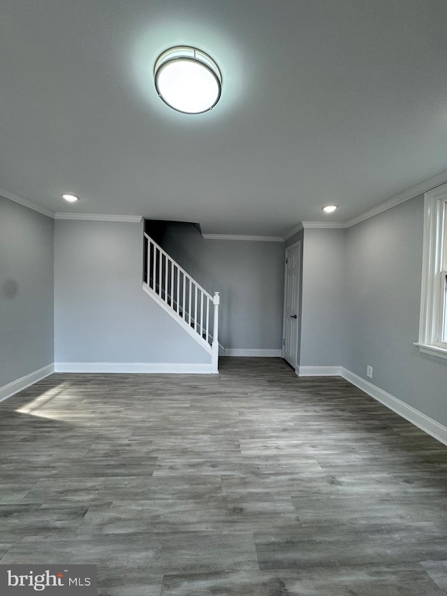 basement featuring hardwood / wood-style flooring and ornamental molding