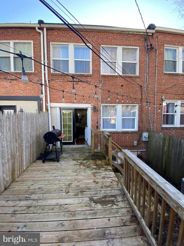 rear view of house featuring a deck