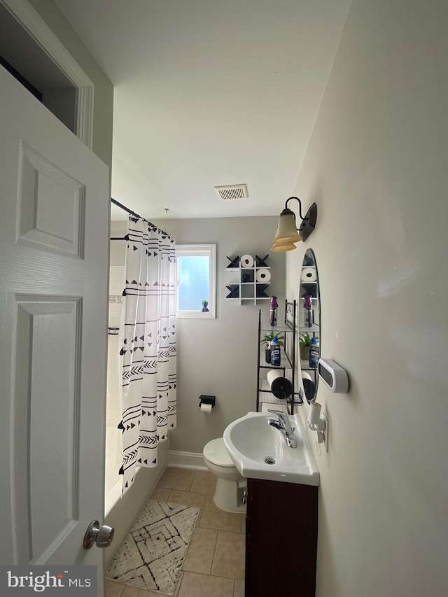 full bathroom featuring tile patterned flooring, shower / bath combination with curtain, toilet, and vanity