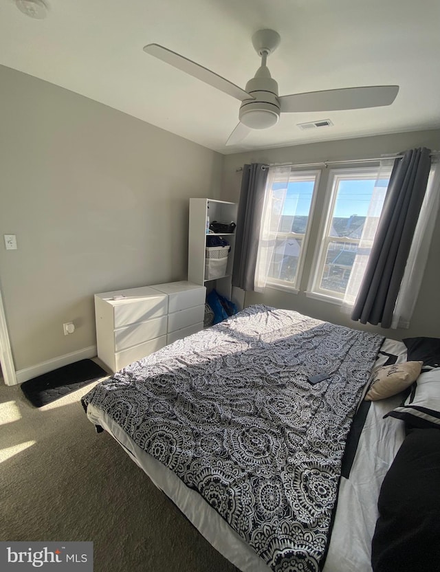 carpeted bedroom with ceiling fan and lofted ceiling