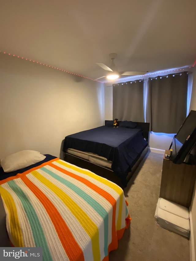 bedroom featuring ceiling fan and carpet floors