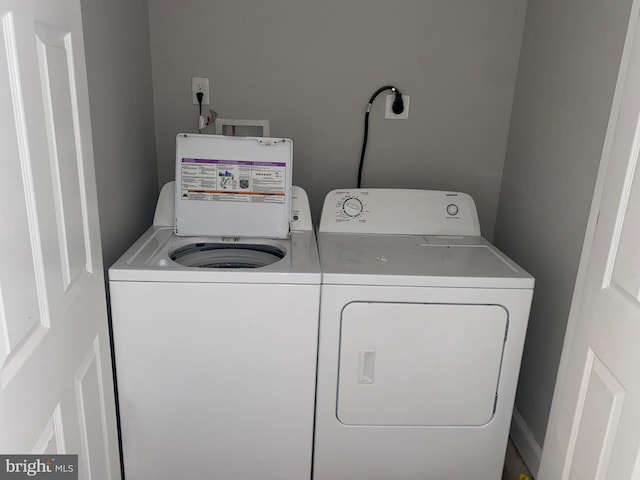 laundry room with independent washer and dryer