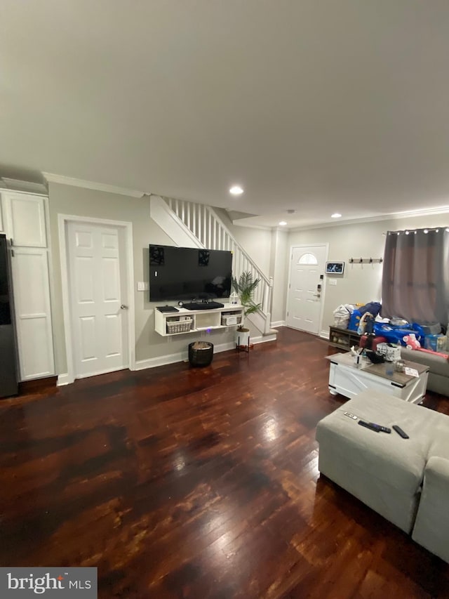 living room with crown molding and dark hardwood / wood-style floors