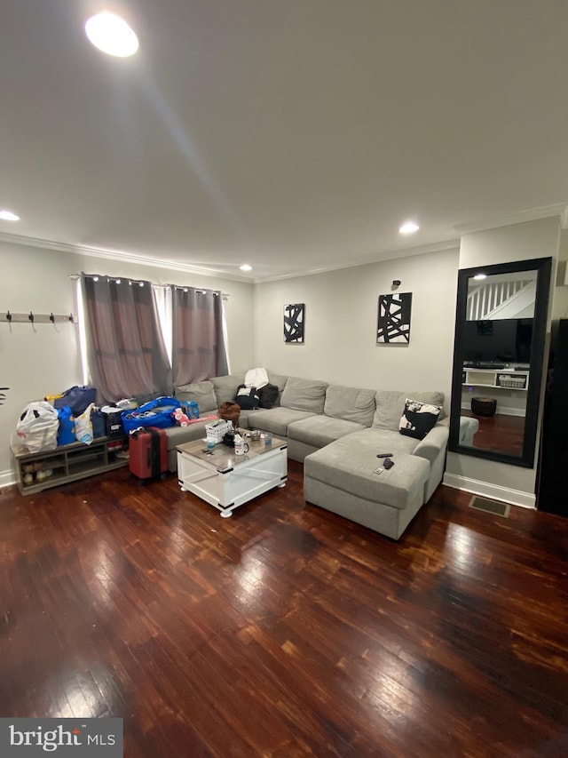 living room with crown molding and dark hardwood / wood-style flooring