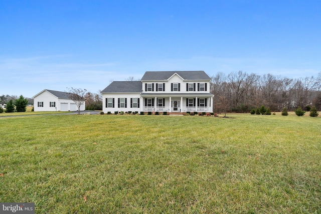 view of front of home featuring covered porch and a front lawn