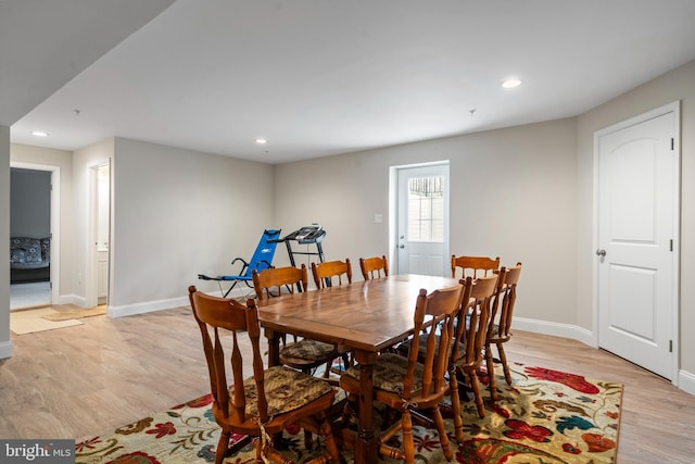 dining space with light wood-type flooring