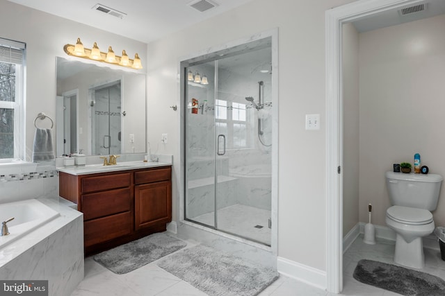 full bathroom featuring vanity, independent shower and bath, and toilet