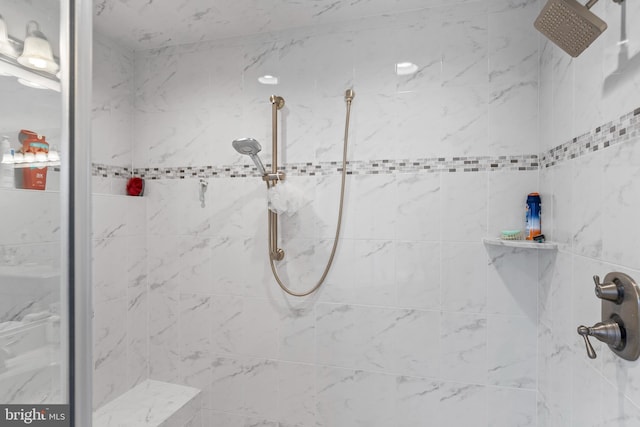 bathroom with tiled shower