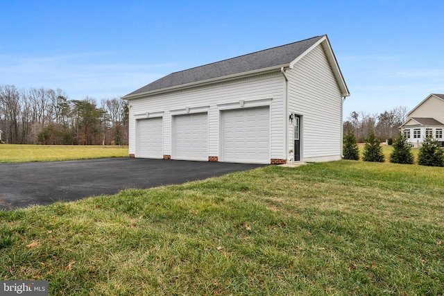 garage with a yard