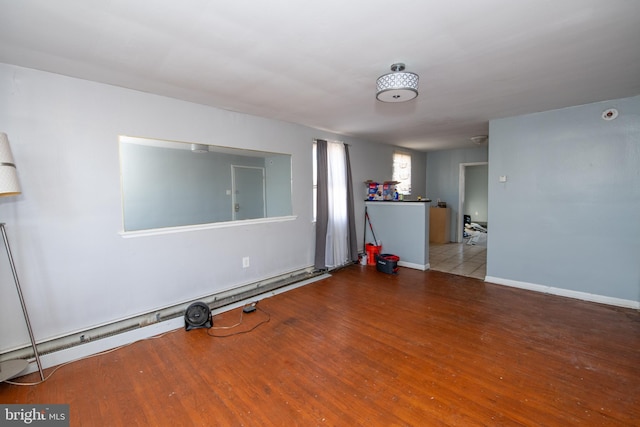 spare room with hardwood / wood-style flooring