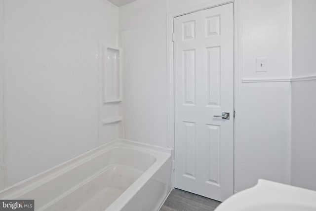 bathroom with hardwood / wood-style floors