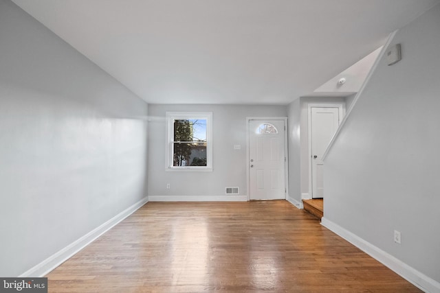 spare room featuring light wood-type flooring