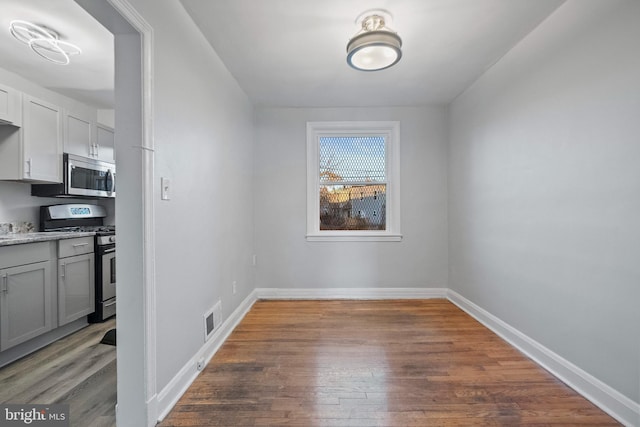 interior space with dark hardwood / wood-style floors