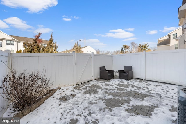 view of yard layered in snow