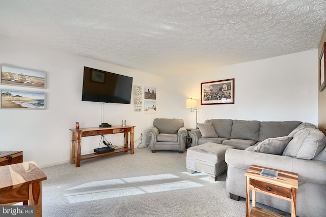 carpeted living room featuring a textured ceiling