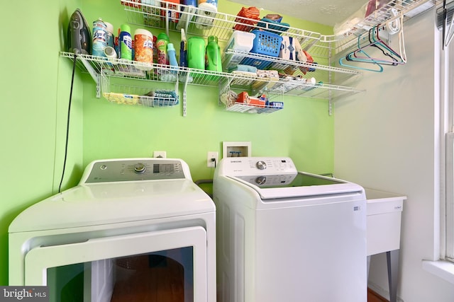 washroom with separate washer and dryer