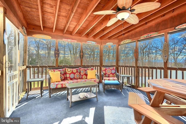 sunroom / solarium featuring ceiling fan, beam ceiling, and wood ceiling