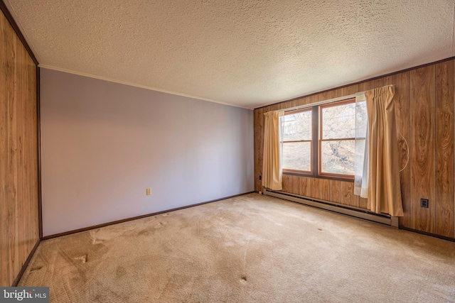 unfurnished room with ornamental molding, a textured ceiling, light carpet, and a baseboard radiator