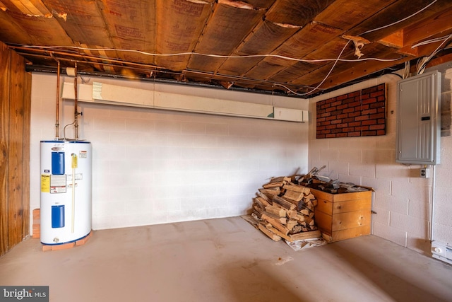 basement featuring electric panel and water heater