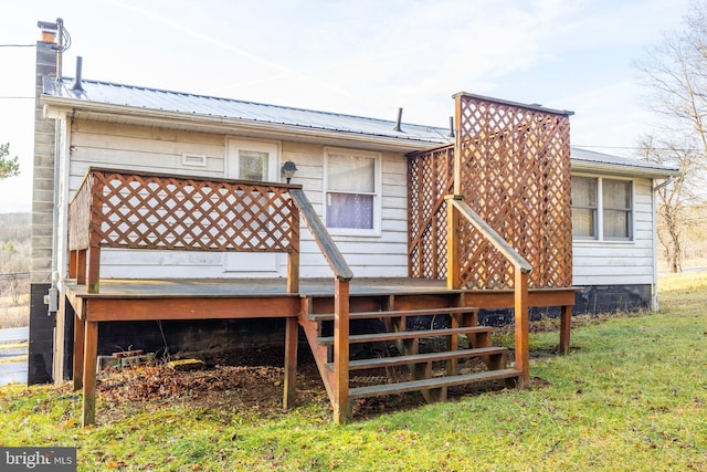 back of house with a wooden deck