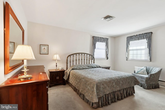 bedroom featuring light colored carpet