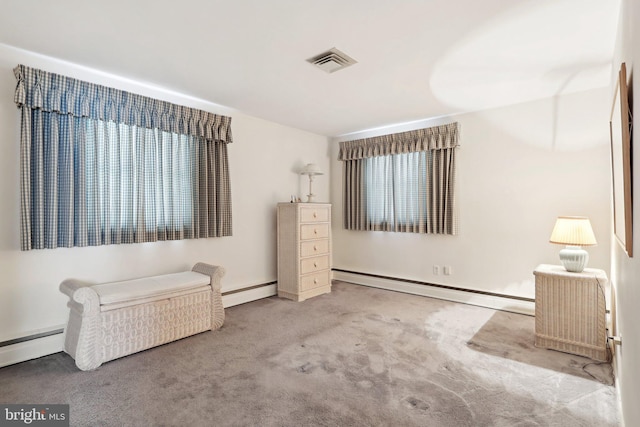 unfurnished room featuring carpet floors and a baseboard radiator