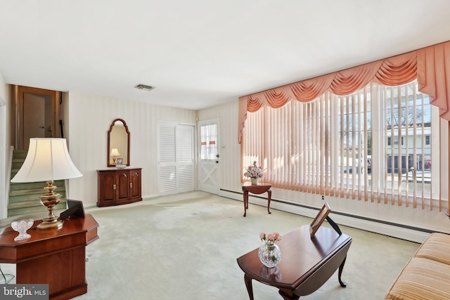 living room with carpet floors and baseboard heating