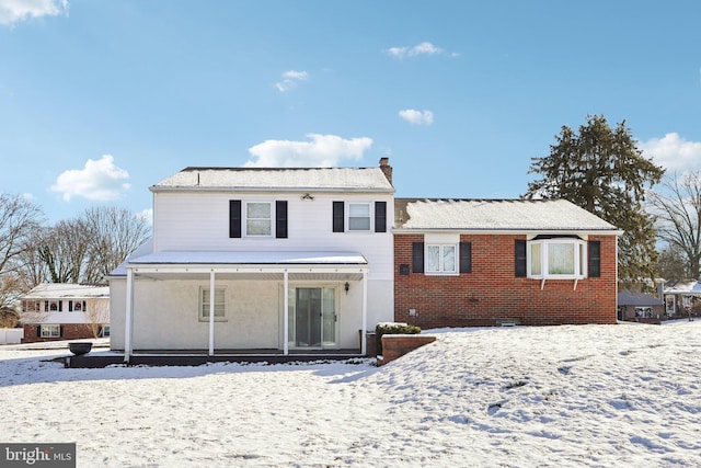 view of snow covered property