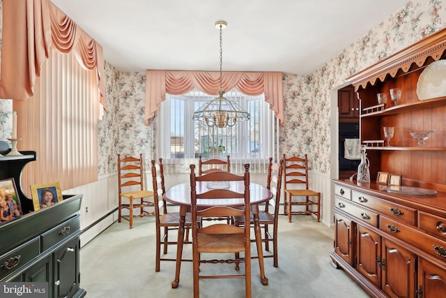 carpeted dining space with a baseboard radiator and a notable chandelier