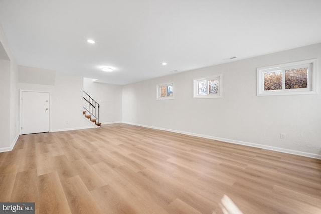 basement featuring light hardwood / wood-style floors