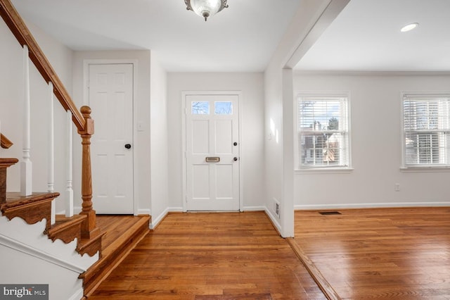 entryway with hardwood / wood-style flooring