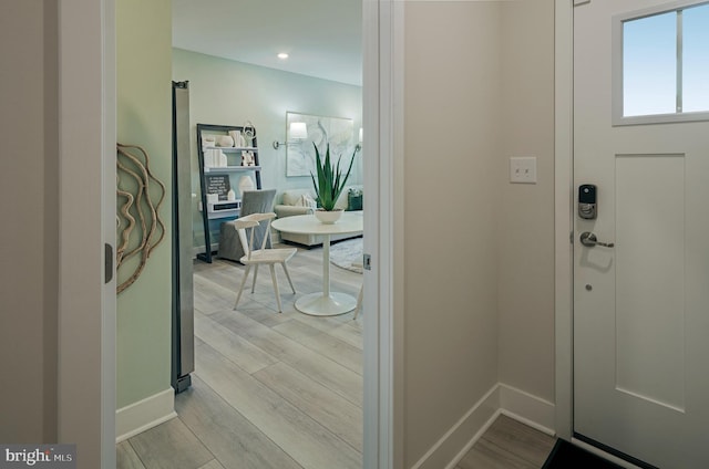 entryway with light hardwood / wood-style flooring