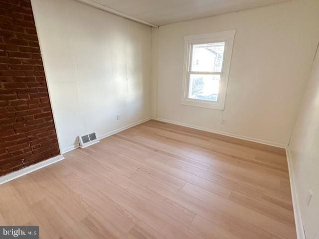 unfurnished room featuring light hardwood / wood-style flooring