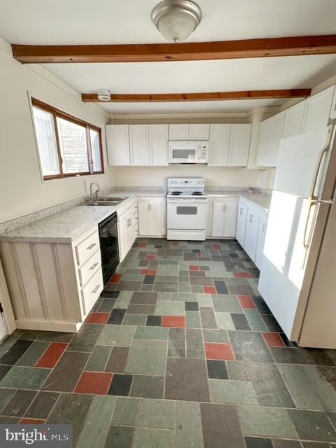 kitchen featuring beamed ceiling, white cabinetry, white appliances, and sink