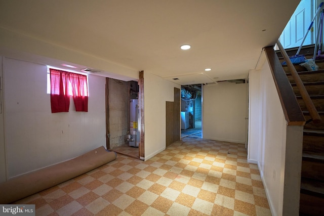 basement featuring washer / clothes dryer and gas water heater