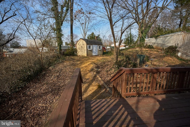 exterior space with a wooden deck and a shed