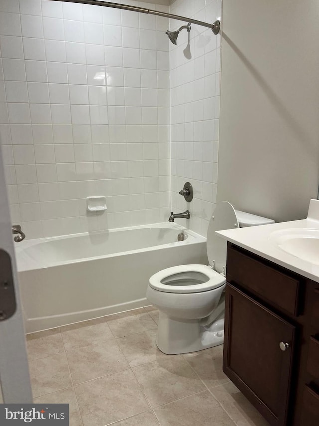 full bathroom featuring vanity, toilet, and tiled shower / bath