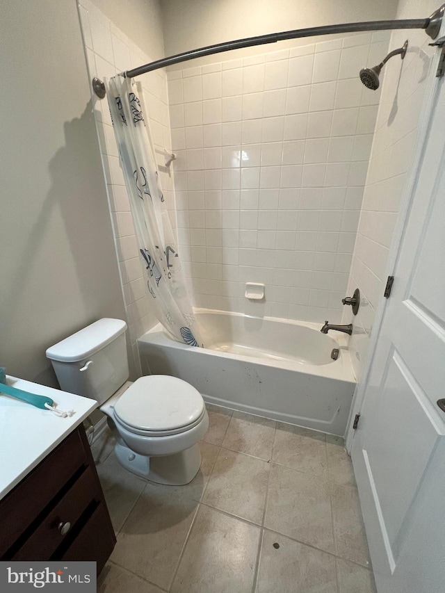 full bathroom featuring shower / bath combination with curtain, vanity, toilet, and tile patterned floors