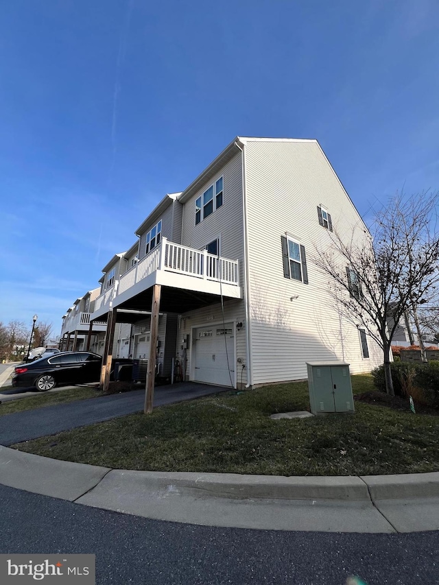 view of side of home with a garage