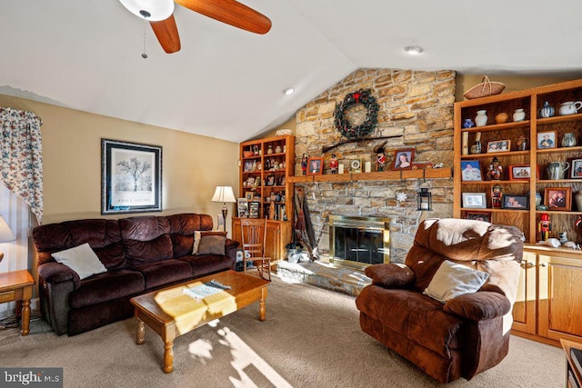 carpeted living room featuring a fireplace, ceiling fan, and lofted ceiling