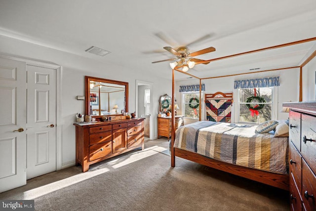 bedroom featuring ceiling fan, a closet, and carpet floors