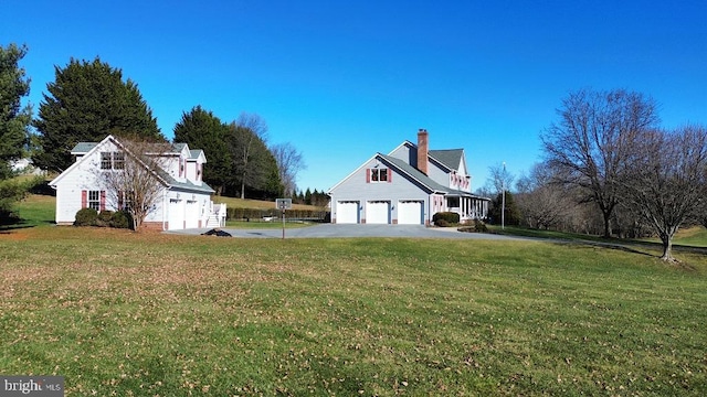 view of home's exterior featuring a garage and a lawn