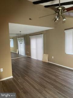 unfurnished room featuring beamed ceiling, dark hardwood / wood-style floors, and ceiling fan