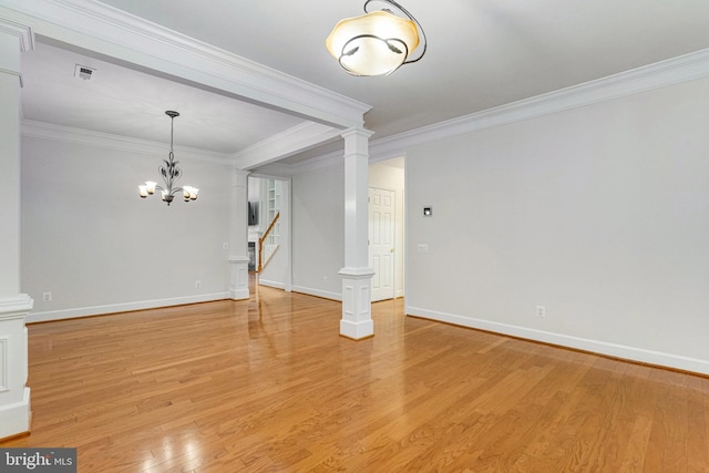 unfurnished living room with light wood finished floors, a chandelier, stairway, ornamental molding, and decorative columns