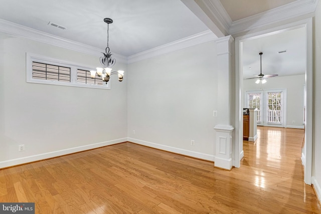 unfurnished room featuring visible vents, baseboards, light wood-style floors, and ornamental molding