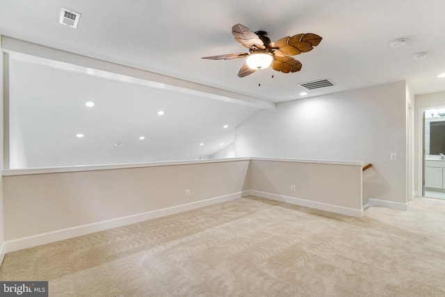 empty room featuring visible vents, baseboards, carpet, and a ceiling fan