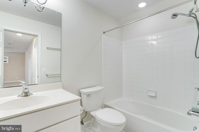 bathroom with recessed lighting, shower / bathing tub combination, toilet, and vanity